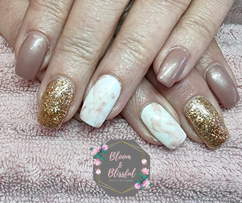 Nude shimmer nails with white marble and gold glitter accent by Emmie