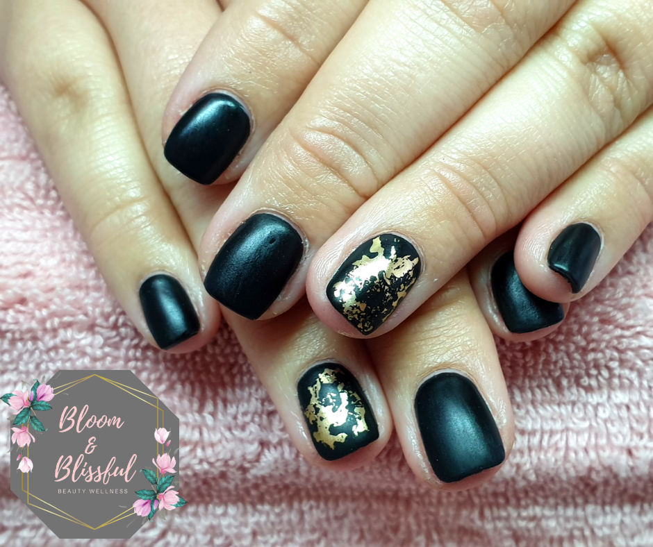Matte black nails with gold foil accent by Emmie