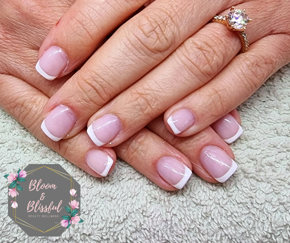 Classic pink and white French tip manicure by Emmie