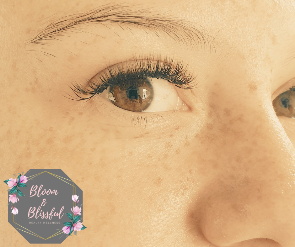 Natural classic lash extensions close-up showing perfect application by Emmie