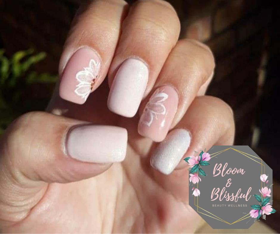 Soft pink matte nails with floral art by Emmie
