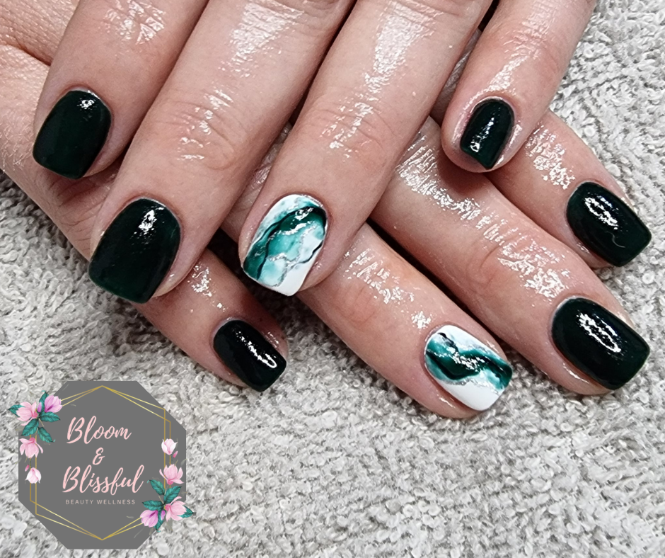 Deep emerald green nails with teal and white marble accent art by Emmie