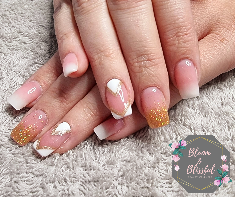 French ombre nails with gold glitter tips and white chevron accent by Emmie