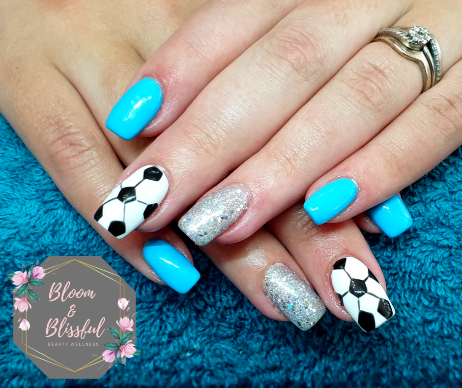 Sky blue nails with soccer ball art and silver glitter by Emmie