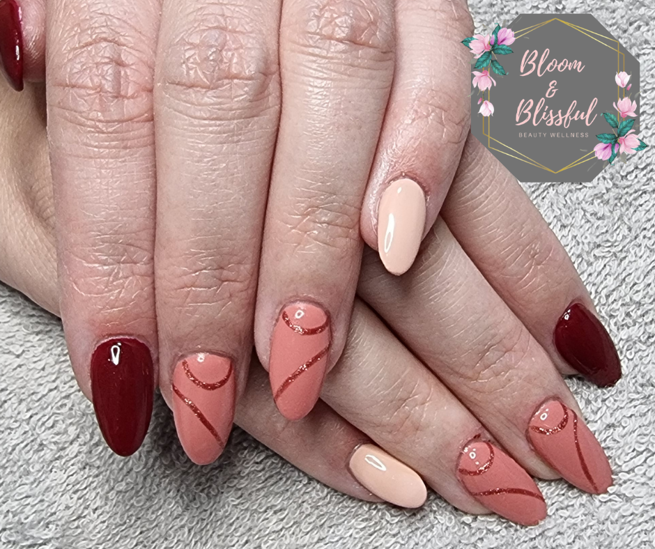 Autumn almond nails in burgundy nude and terracotta with rose gold swirl art by Emmie