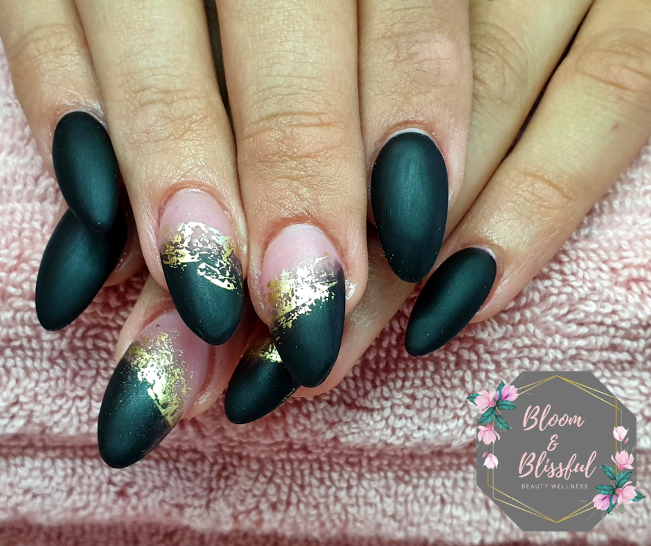 Matte emerald green almond nails with gold foil accent by Emmie