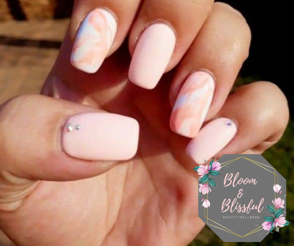 Matte pink marble nails with crystal accent by Emmie