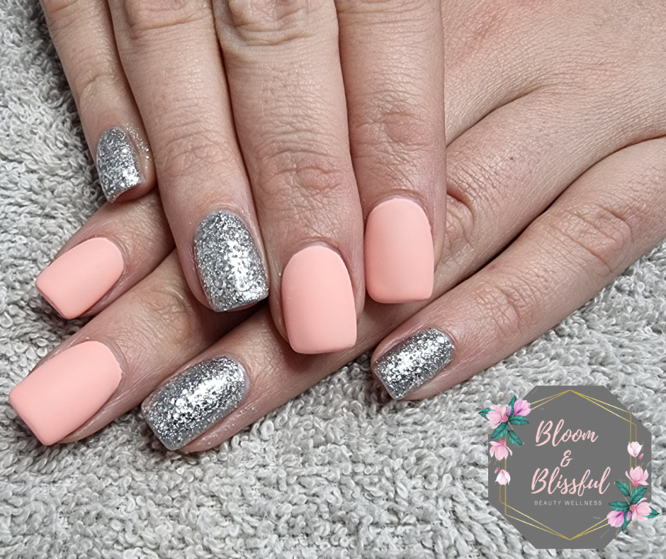 Matte peach coral nails with chunky silver glitter accent by Emmie