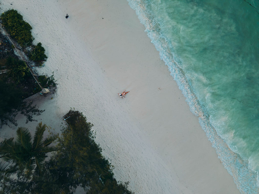 Drone view of couple on Bwejuu beach