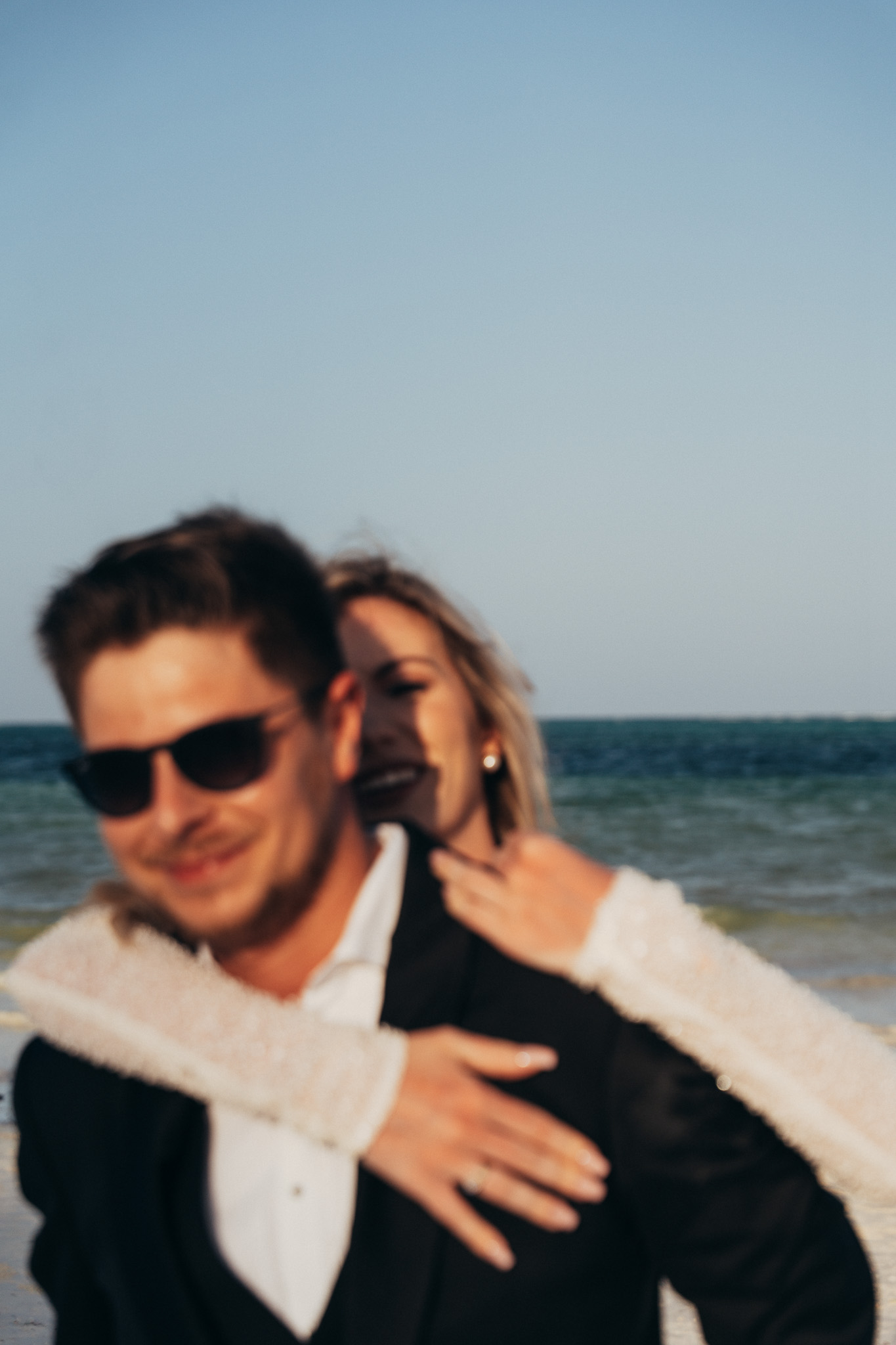 Artistic blurred couple by ocean