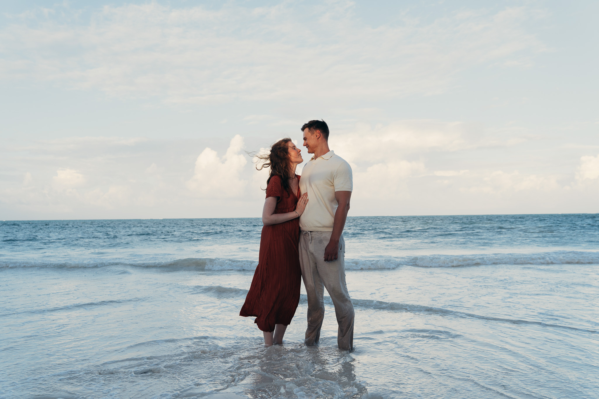 Intimate couple moment at sunset Zanzibar beach