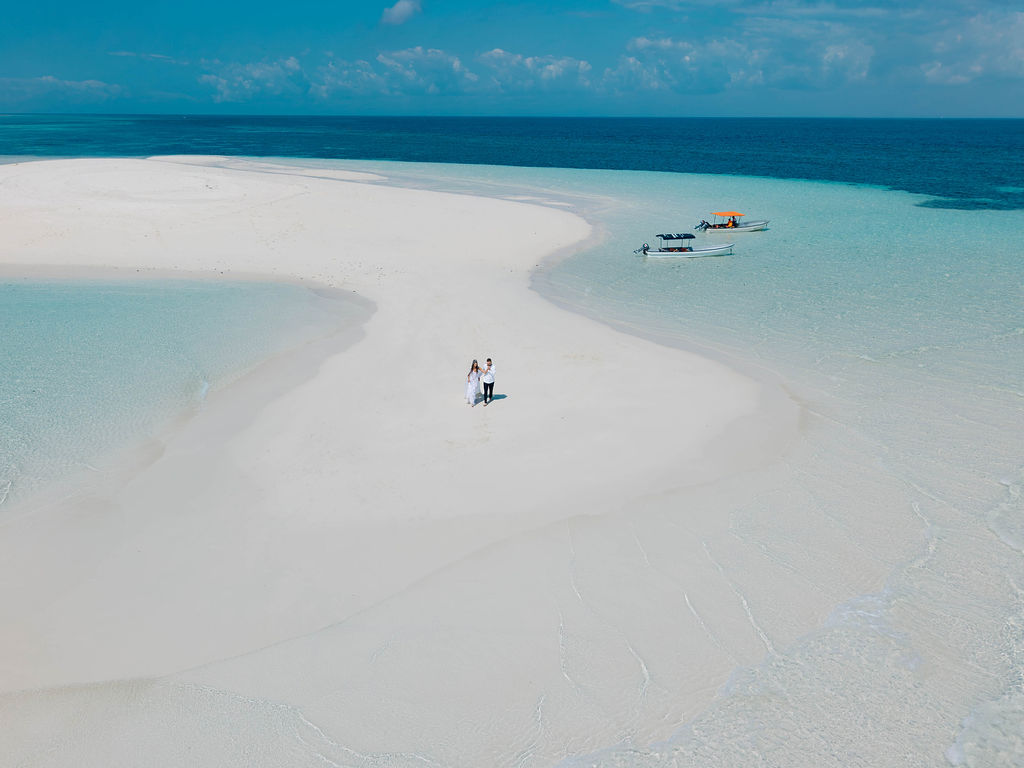 Drone view of couple on sandbank