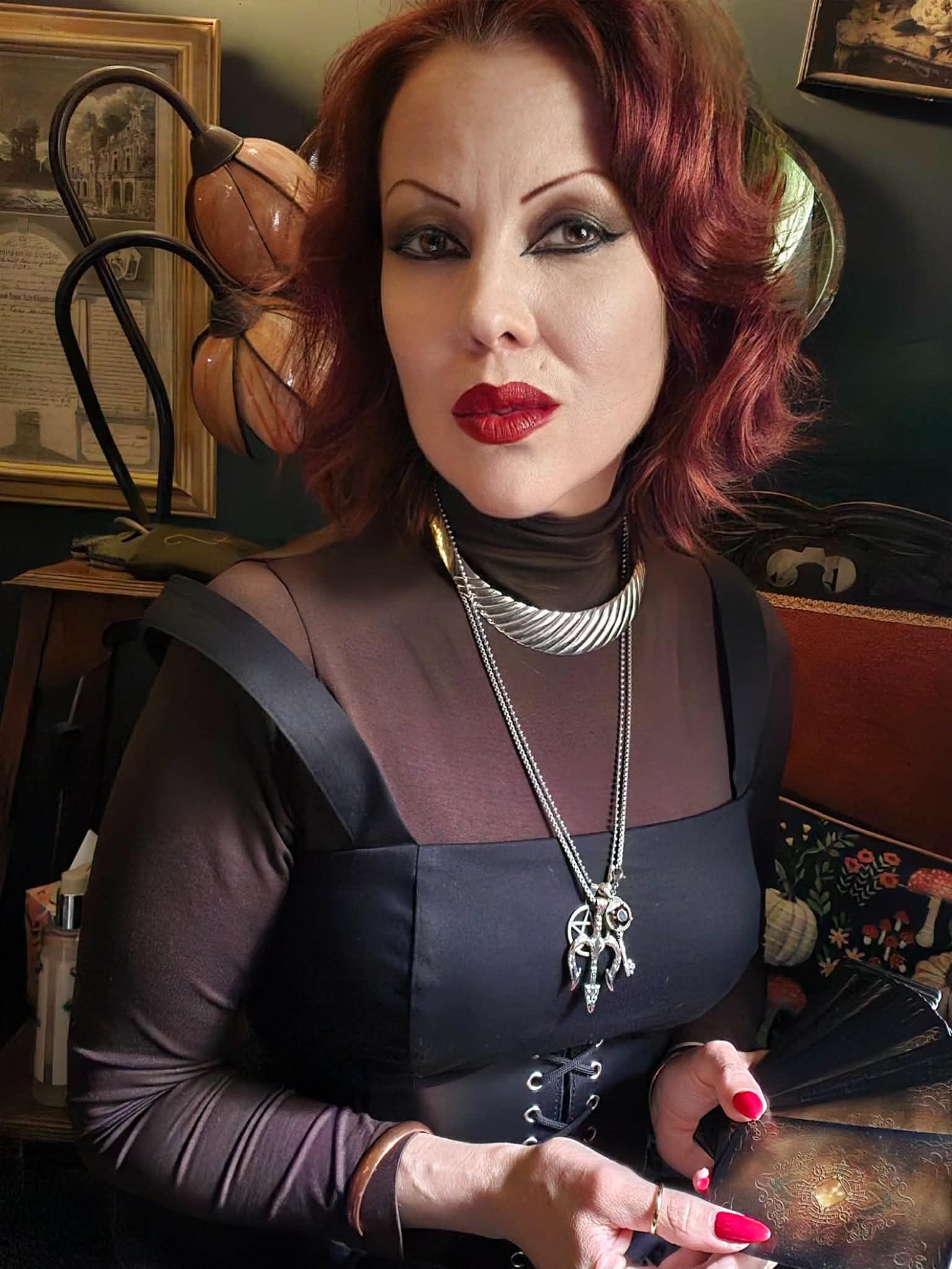 Crystal holding a spread of tarot cards at Portal Leith