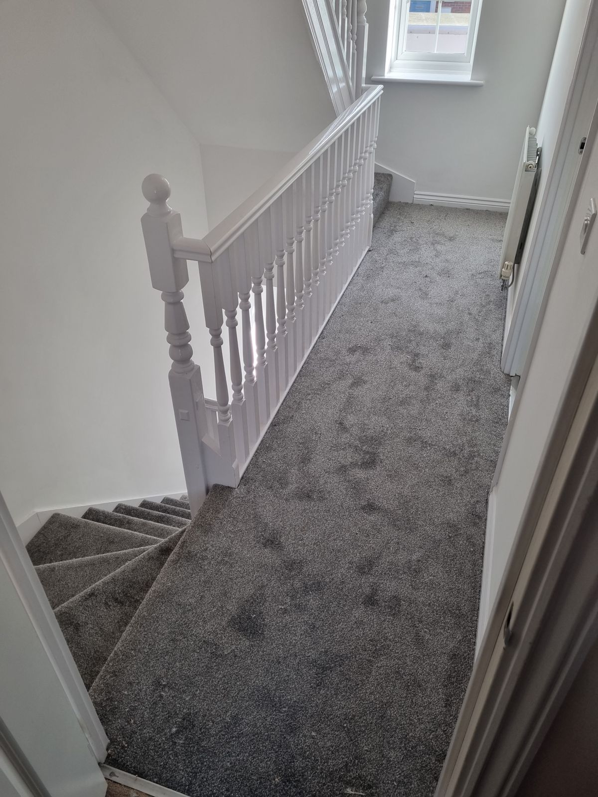 Grey carpet on stairs and landing