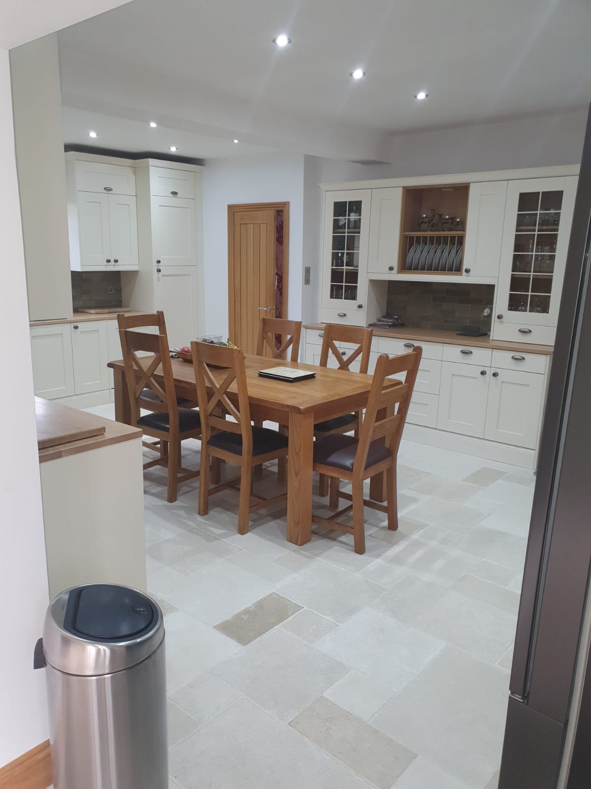 Beautiful kitchen with cream shaker cabinets and wooden worktops fitted by Allsop Interiors