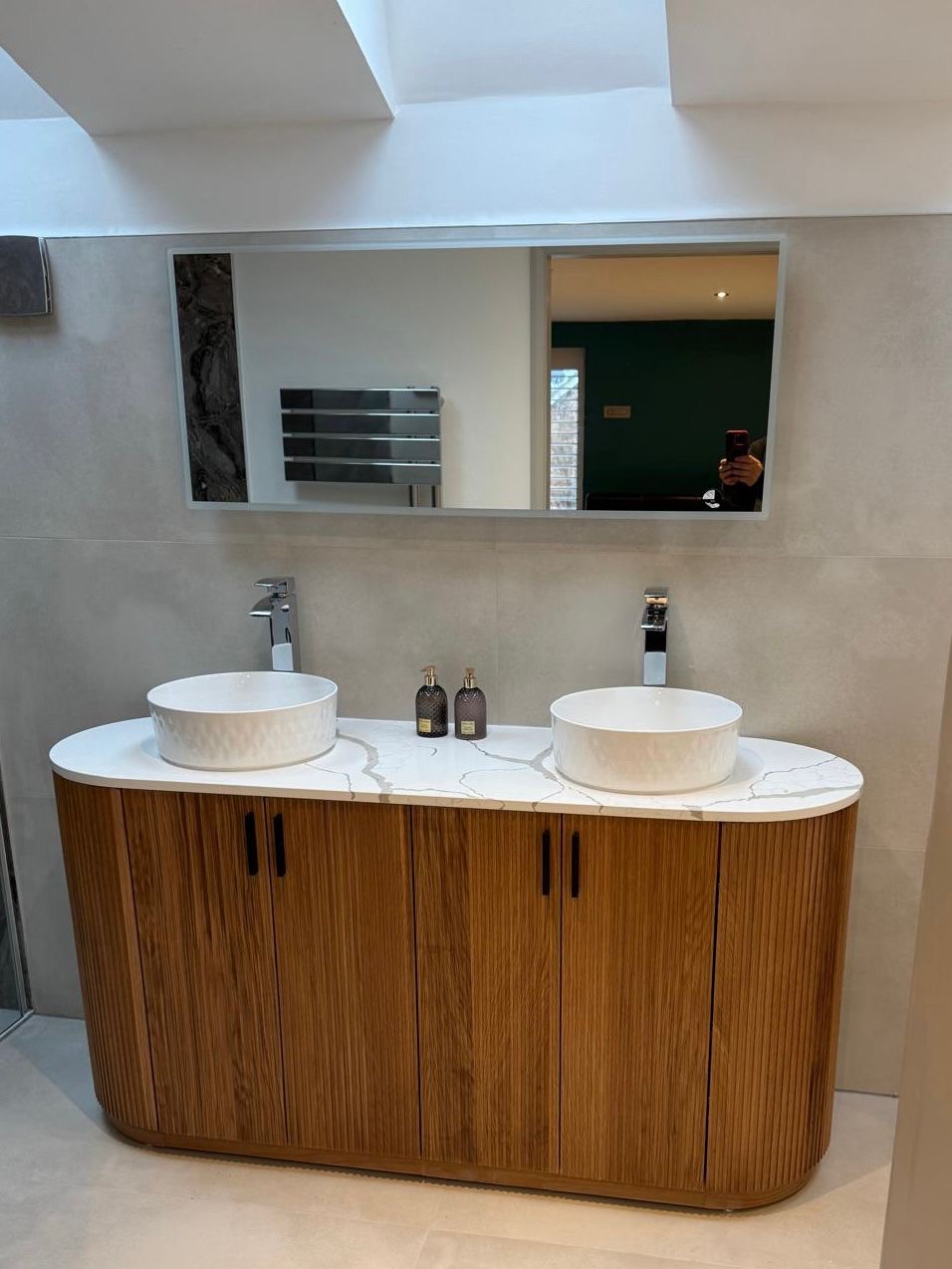 Family bathroom with double vanity and skylight