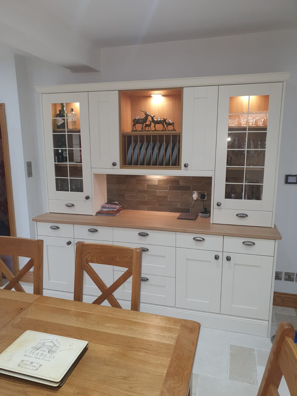 Kitchen dresser unit with glass-fronted display cabinets and plate rack