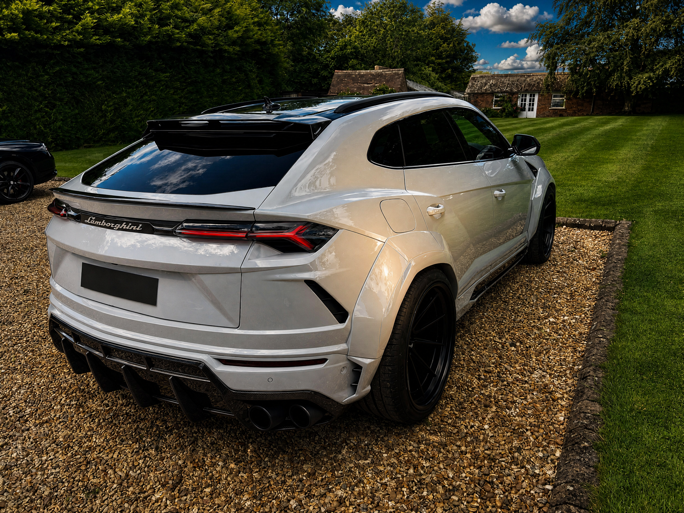 Lamborghini Urus — rear-right stance on the estate gravel