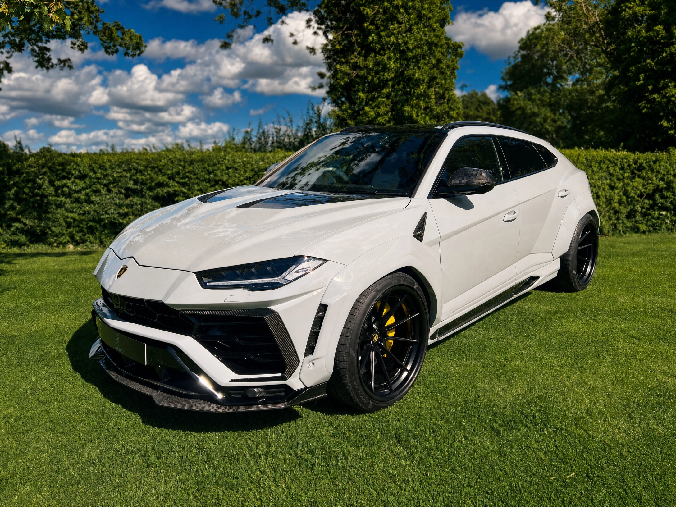Bespoke 1 of 1 UK Lamborghini Urus finished in pale grey, presented on a private estate lawn
