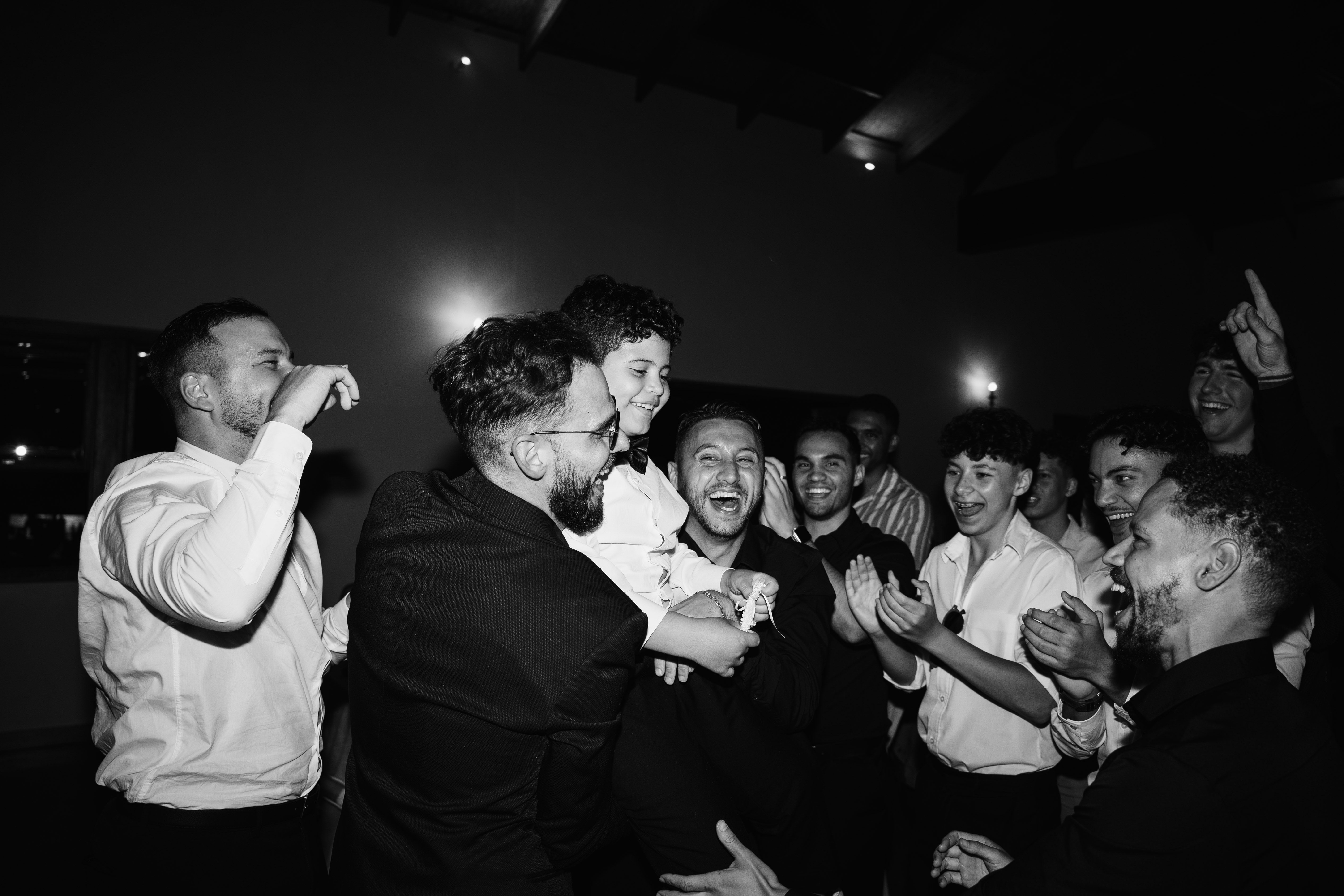 Wedding guests celebrating on the dance floor