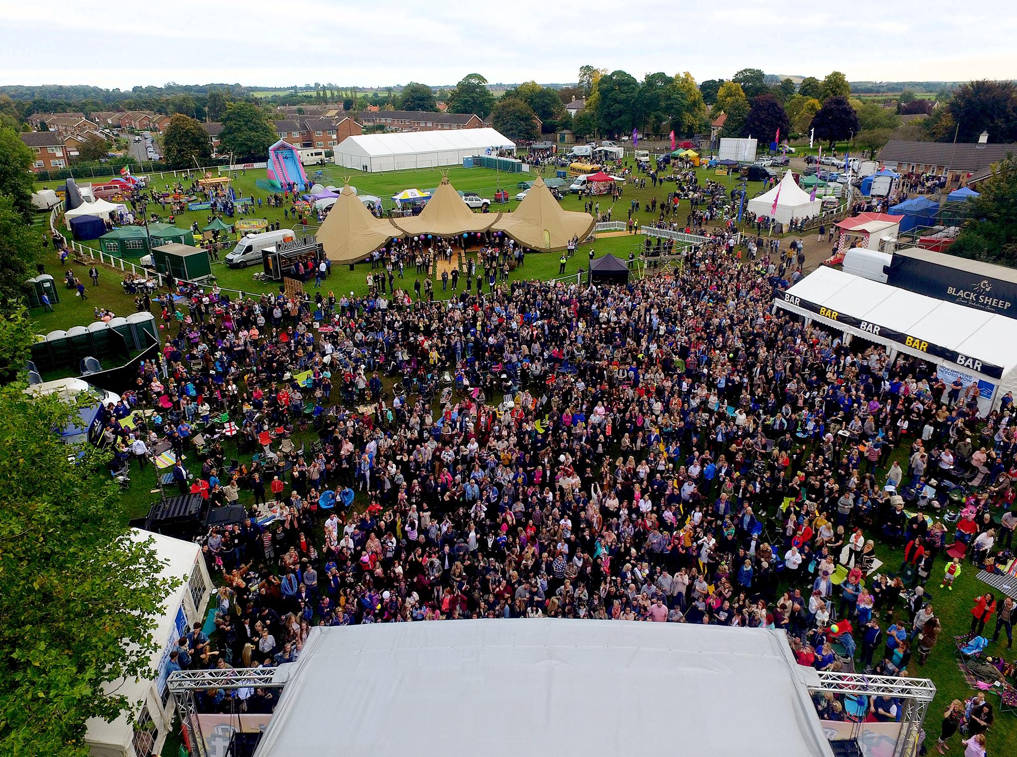 Aerial view of outdoor festival stage with massive crowd — Limitless Event Production Yorkshire
