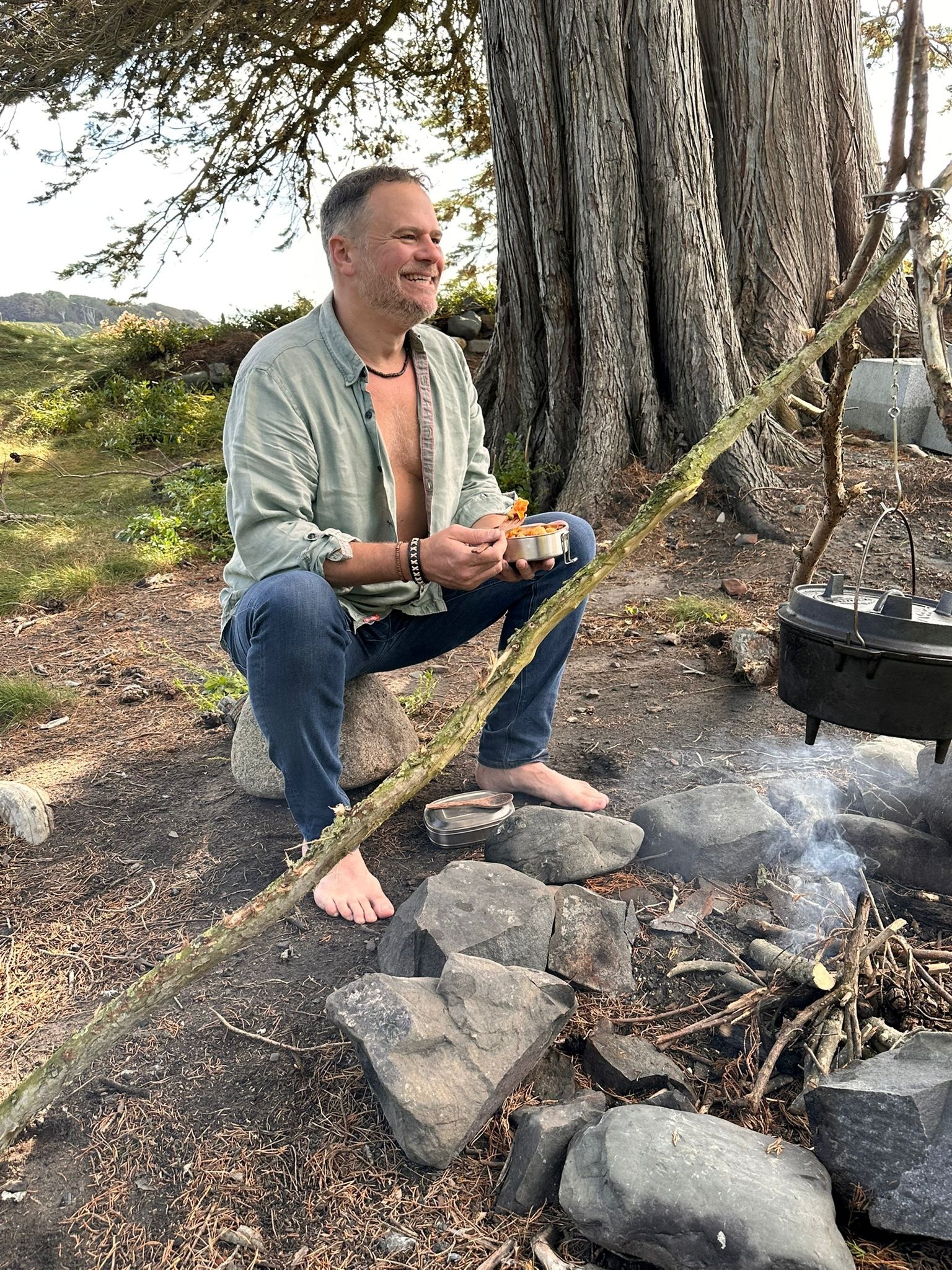 Men gathered around campfire