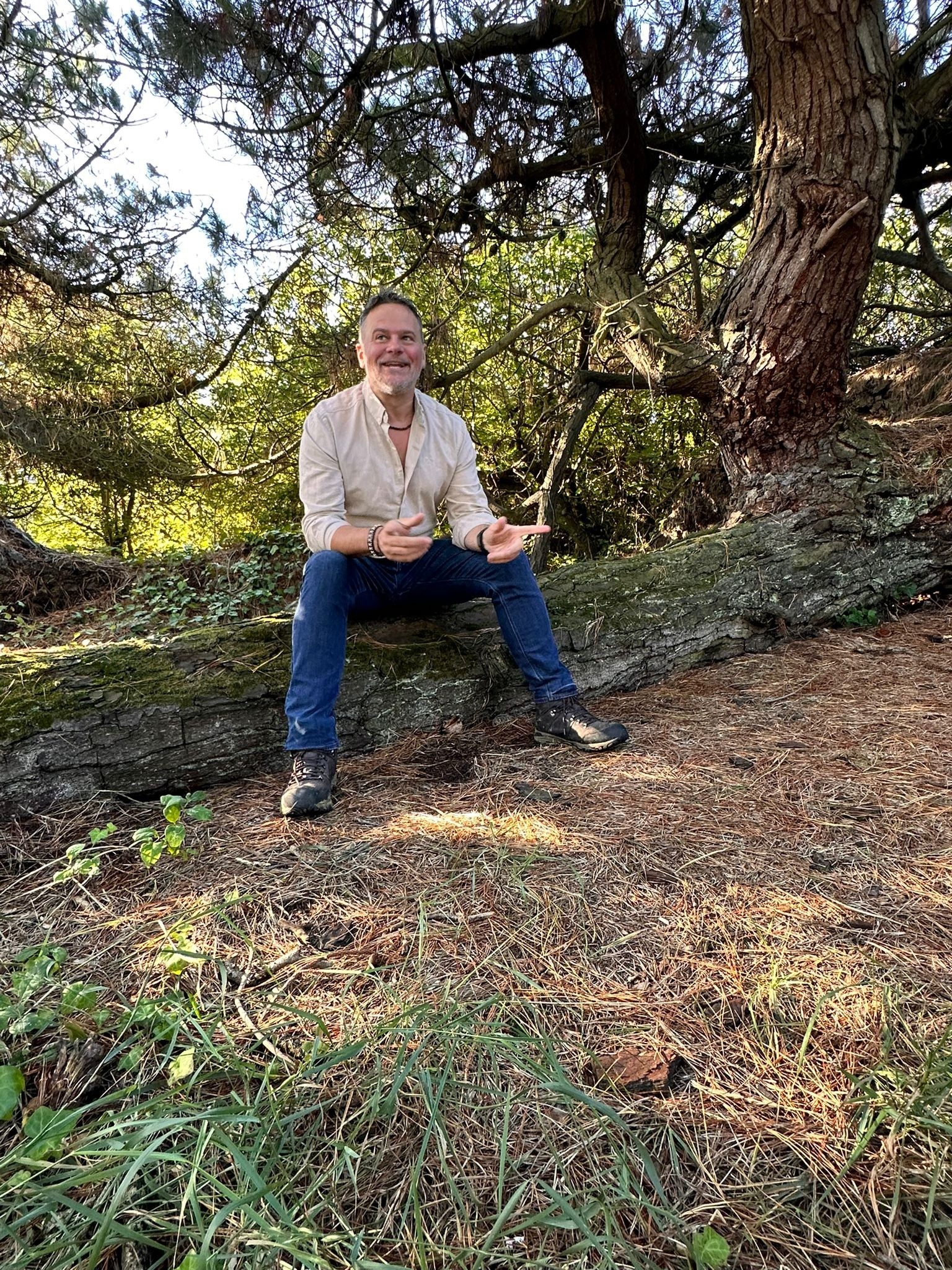 Man sitting in woodland