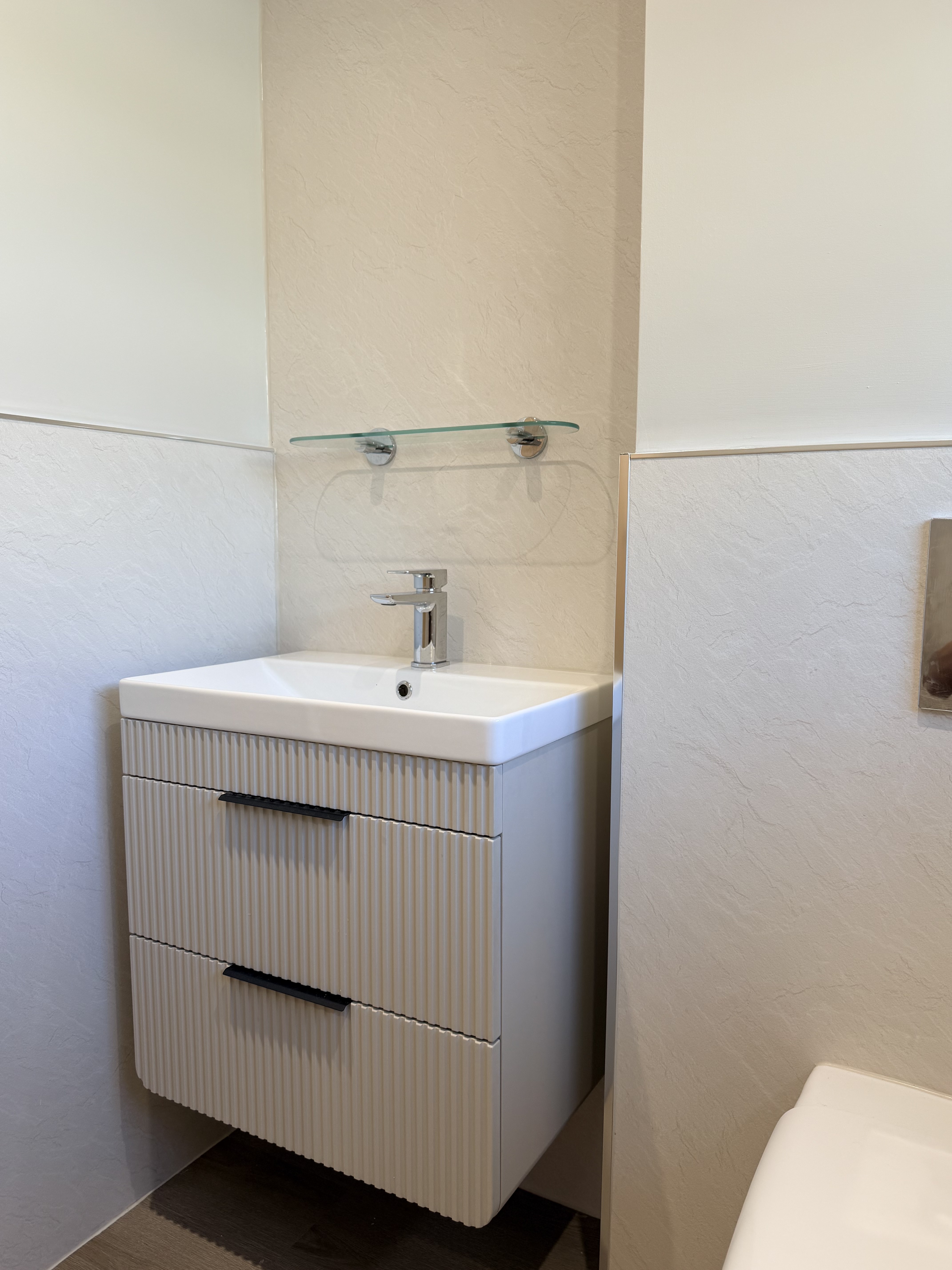 Bathroom renovation in progress — re-plastered walls and new lighting, Wimborne
