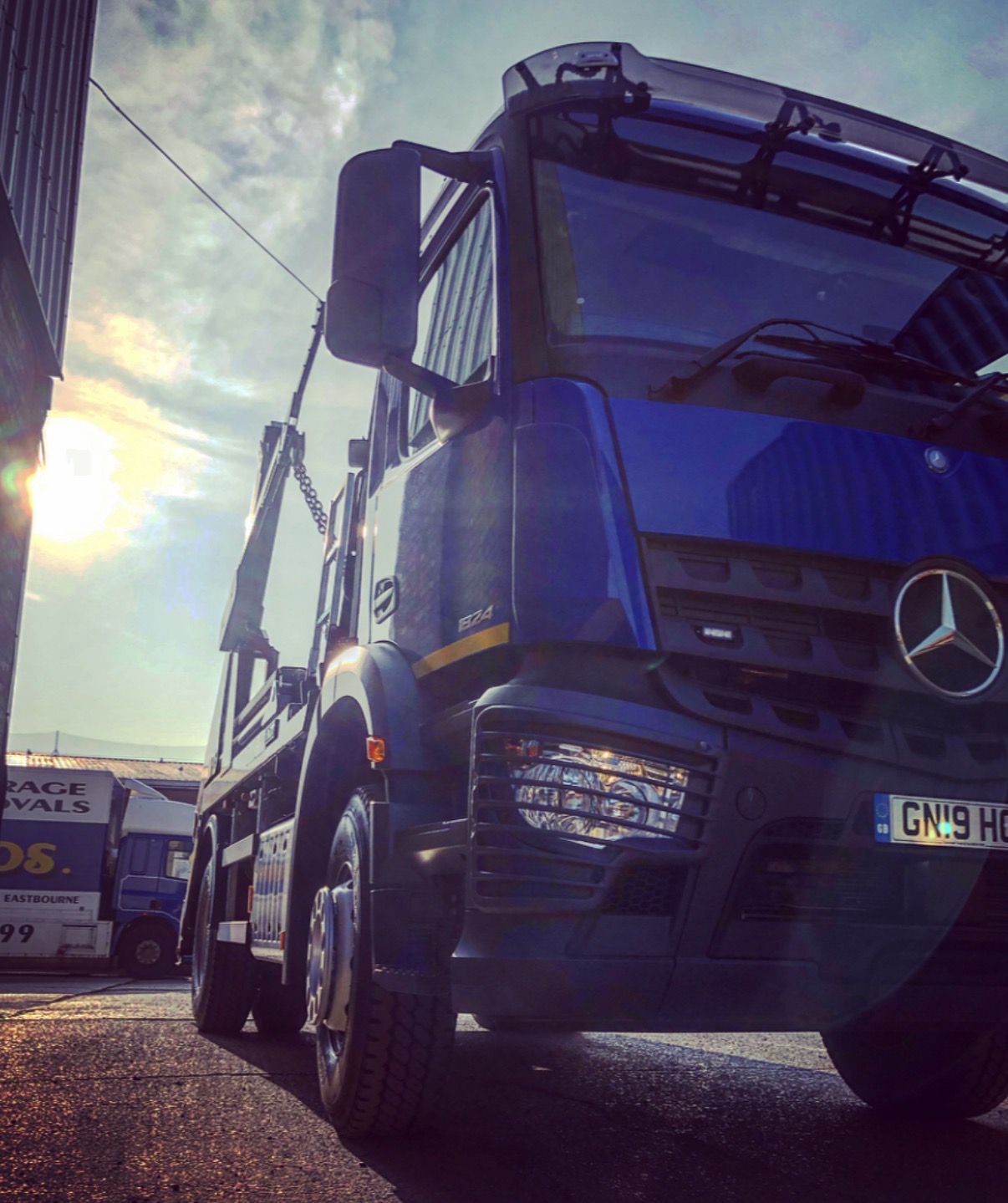 JM Waste Management truck at sunset