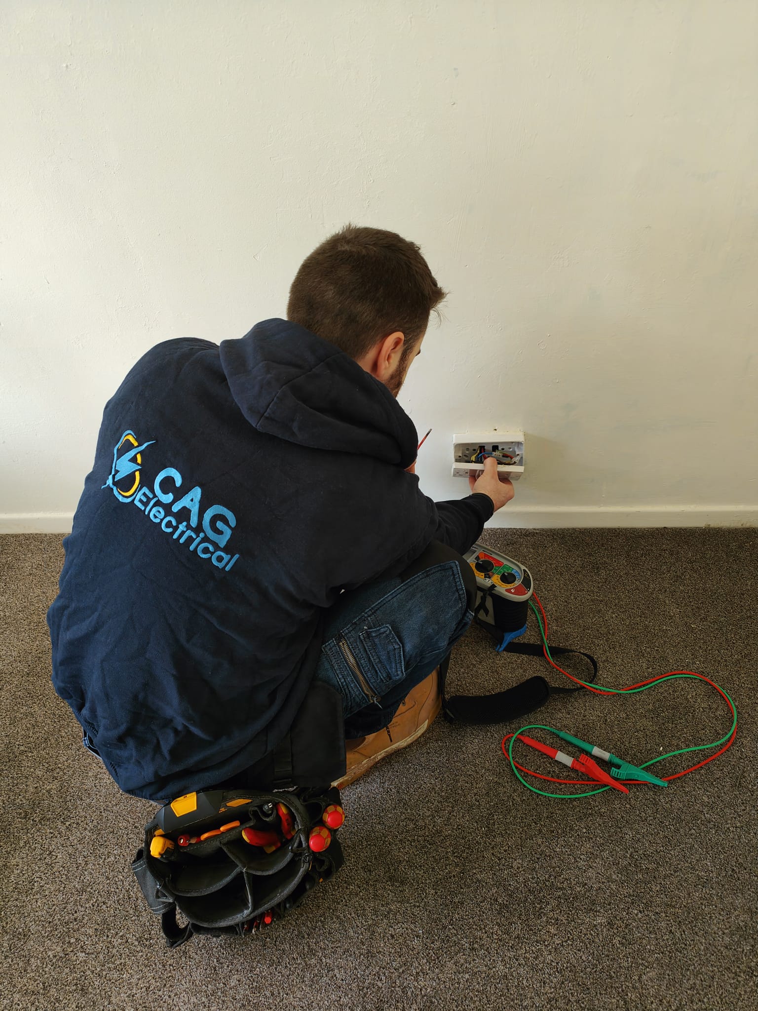 Electrician carrying out EICR testing in Cardiff and Newport