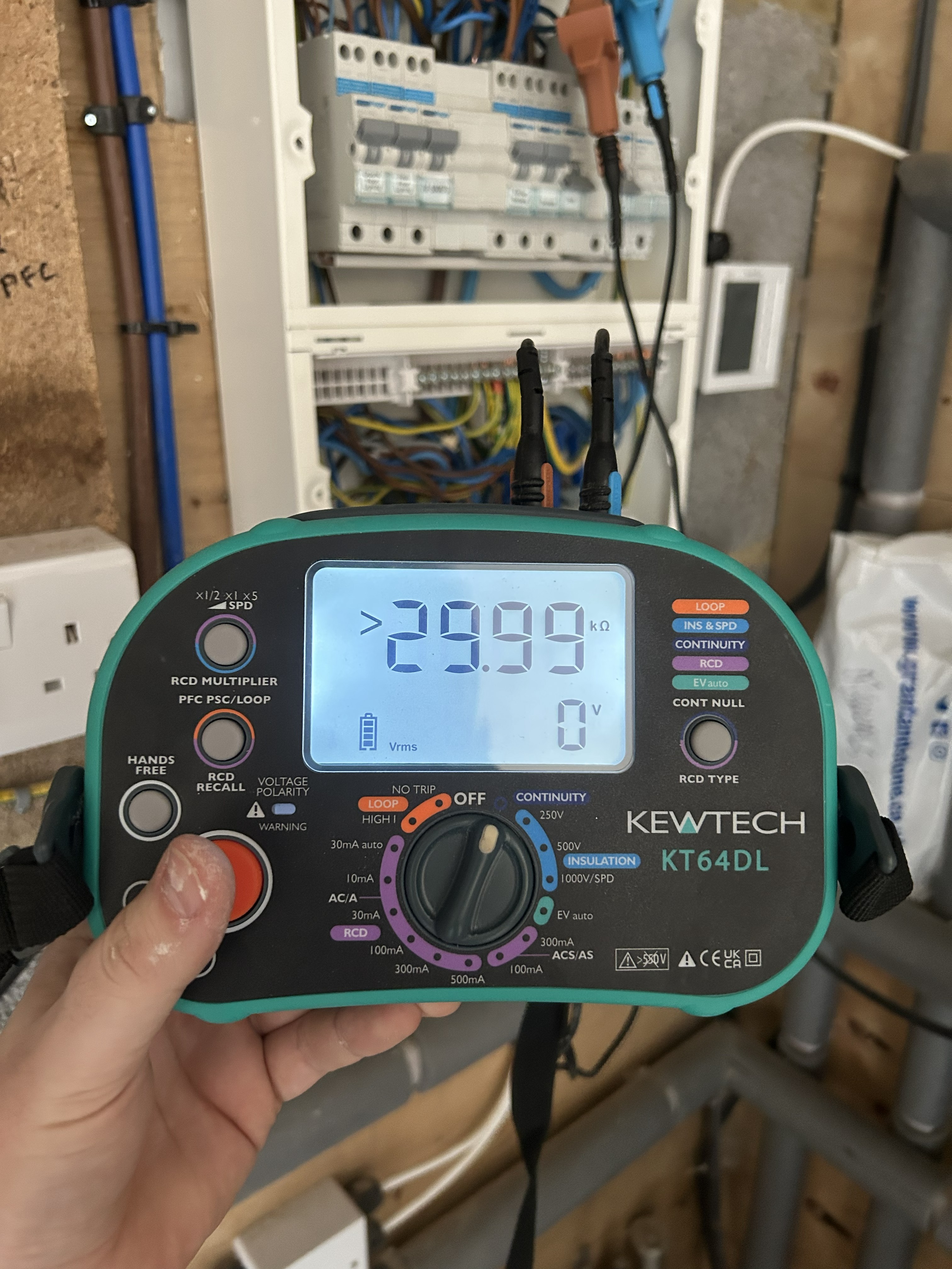 Electrician using Kewtech testing equipment during an EICR