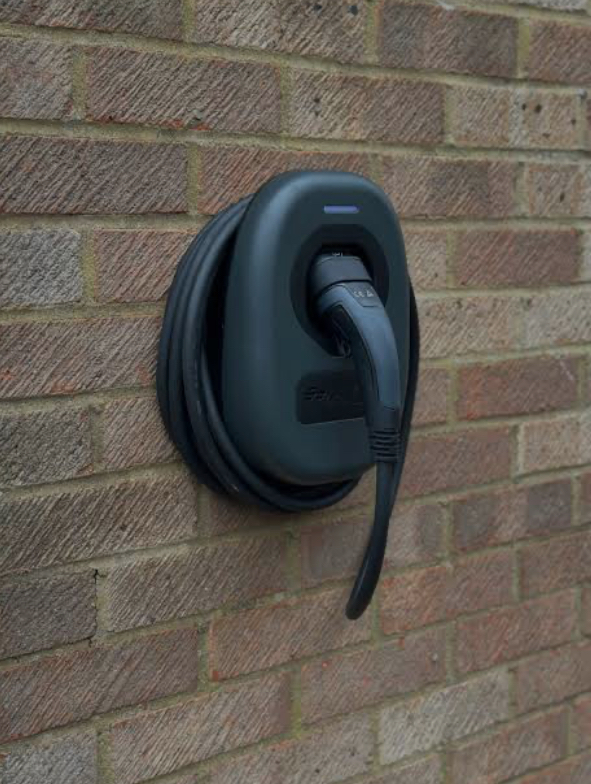BG Sync EV charger installed on brick wall by Power Team Electrics, most affordable home EV charger installation