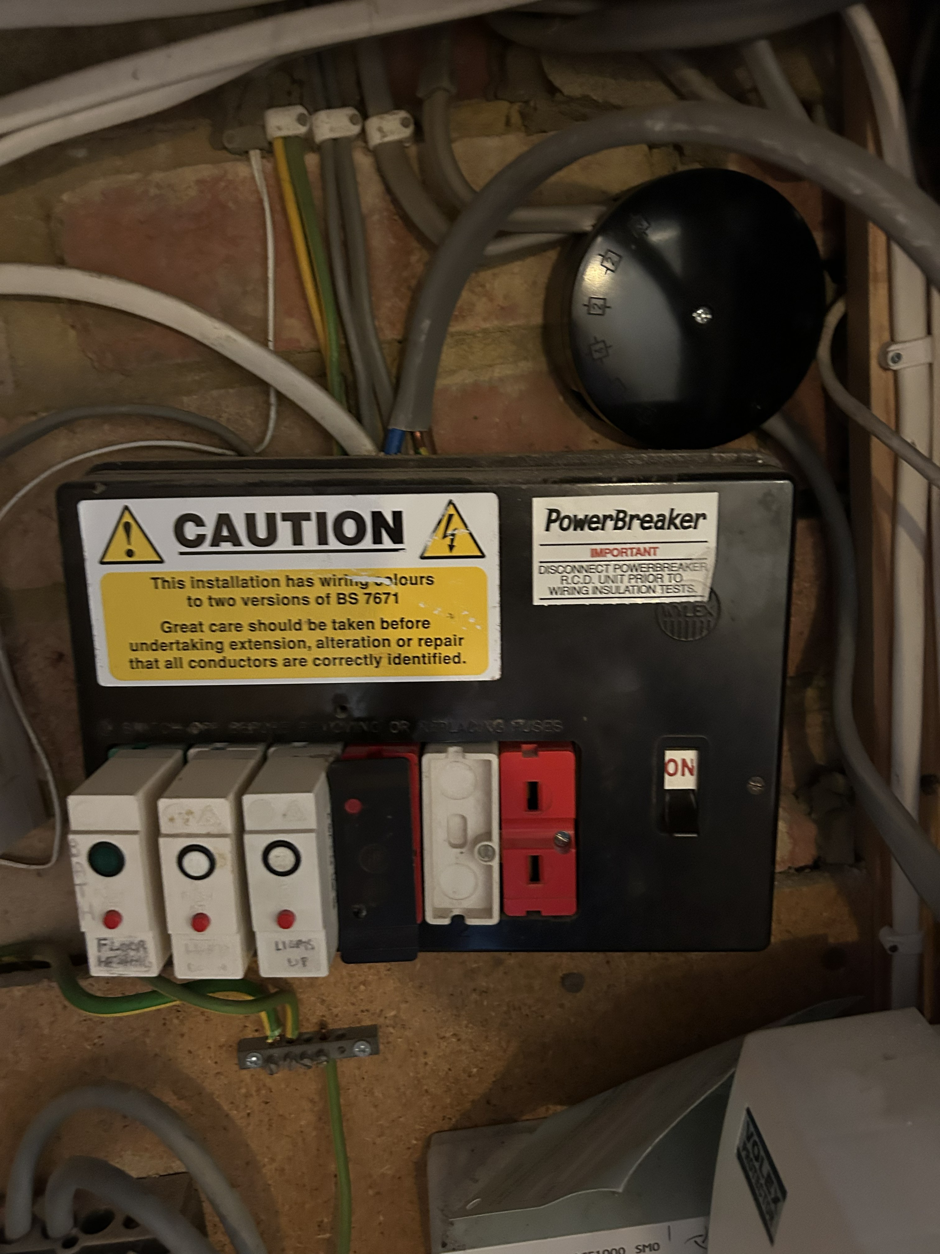 1960s rewirable fuse box — archaic fuse protection, far below modern standards