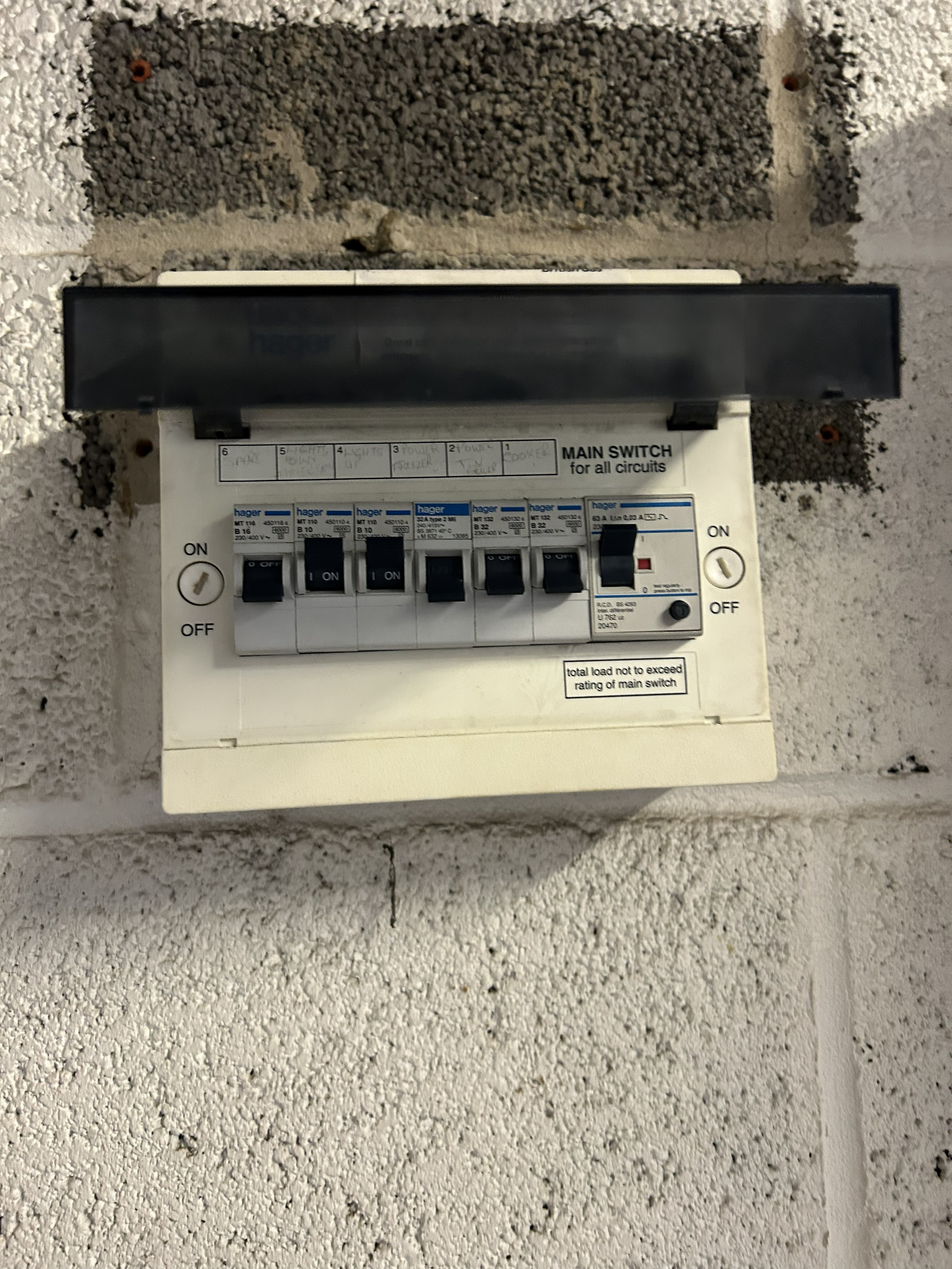 Old Hager 16th Edition consumer unit with plastic enclosure and single whole-property RCD, non-compliant fuse board