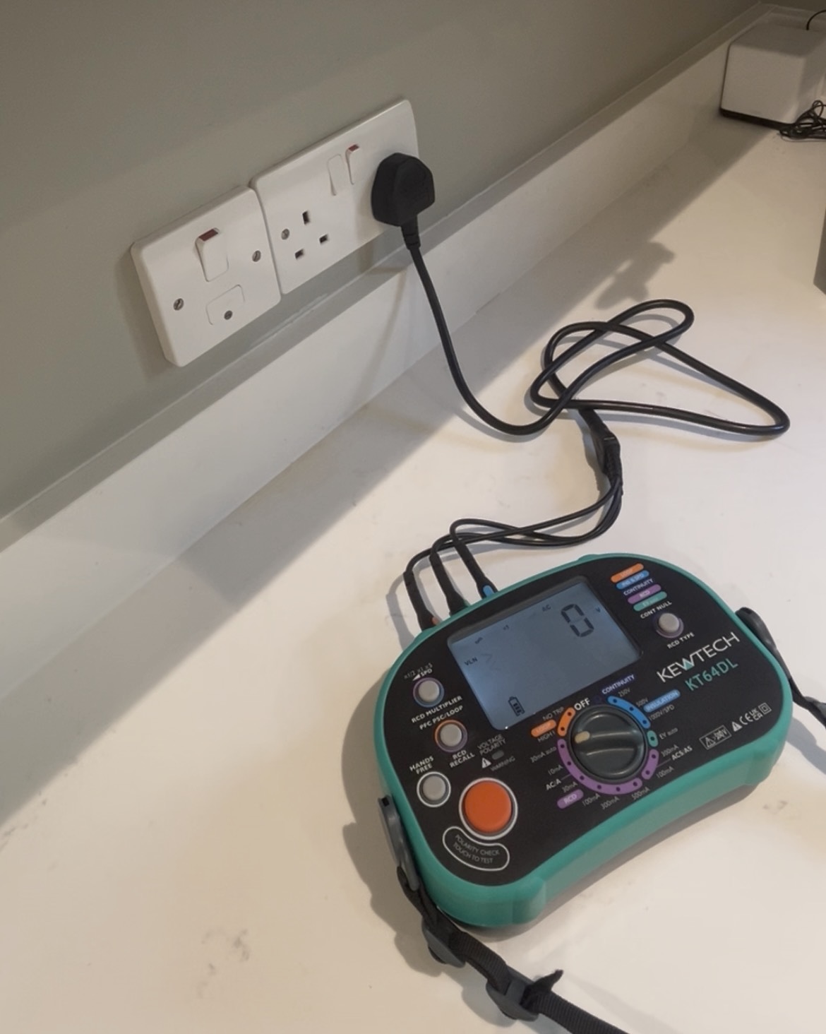 Kewtech KT64DL multifunction tester being used during EICR electrical inspection by Power Team Electrics
