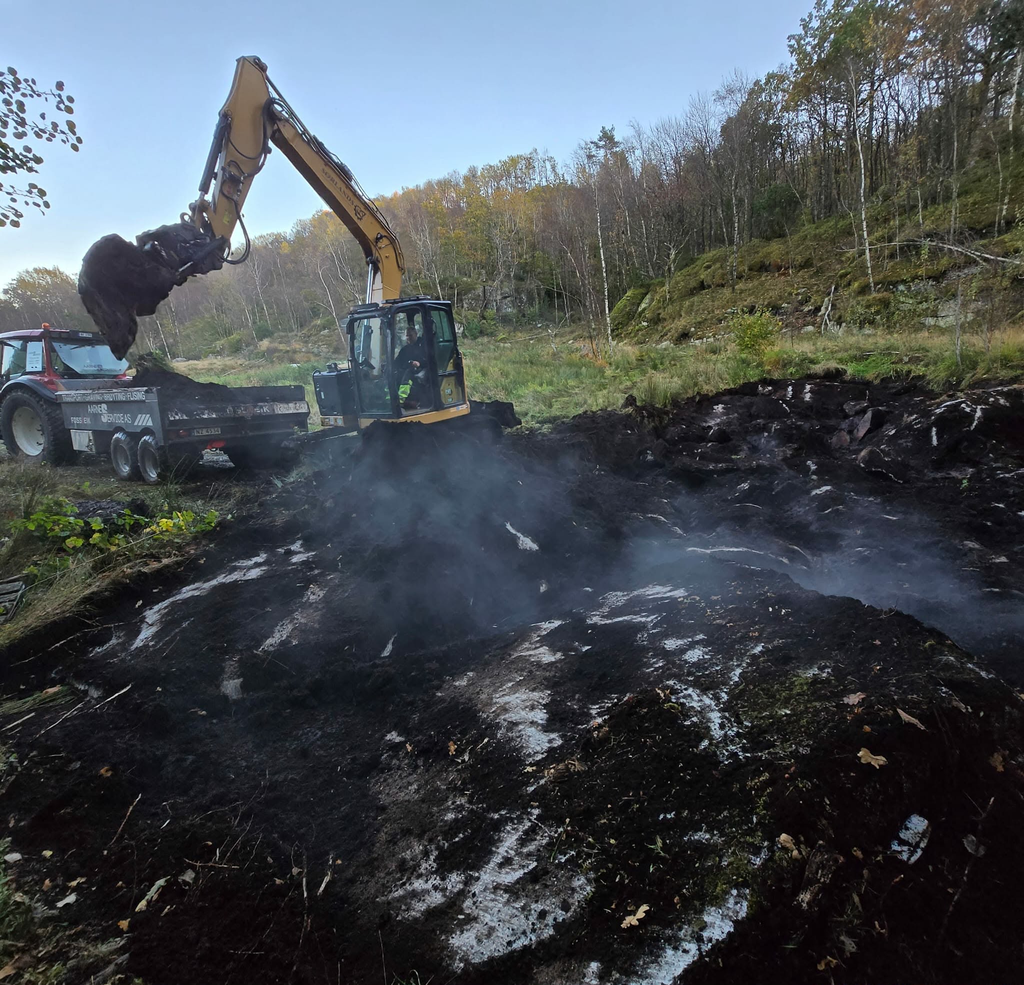 Gravemaskin og transport