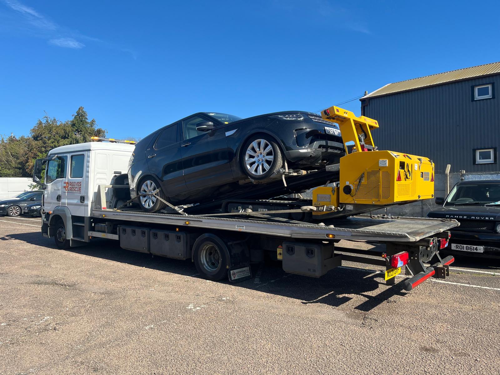 Reeves Rescue specialist vehicle recovery truck with car loaded